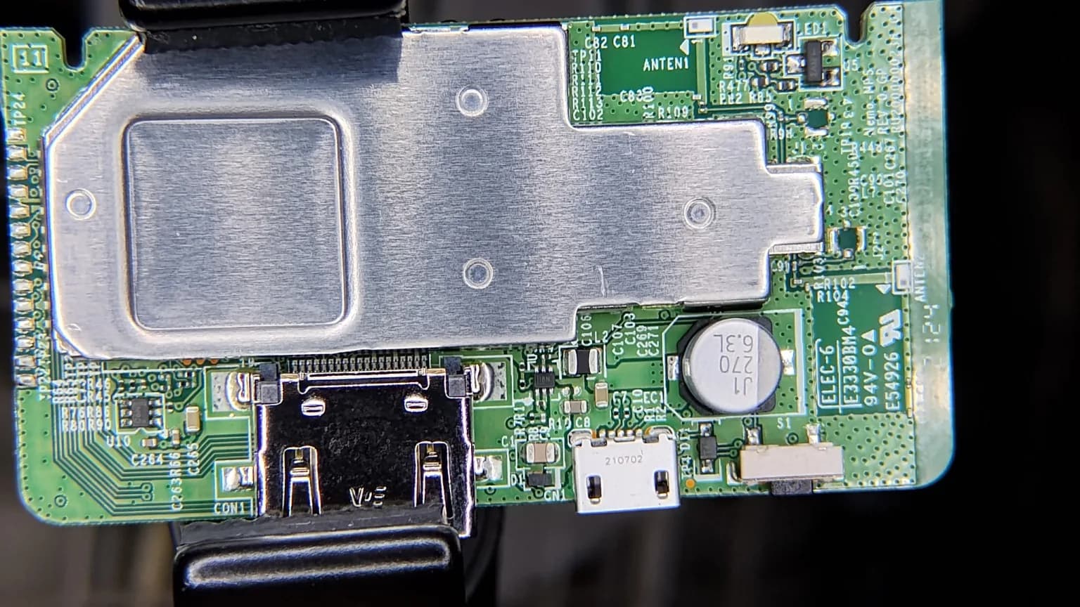 Electronics circuit board being inspected at the Matthew Web workbench.